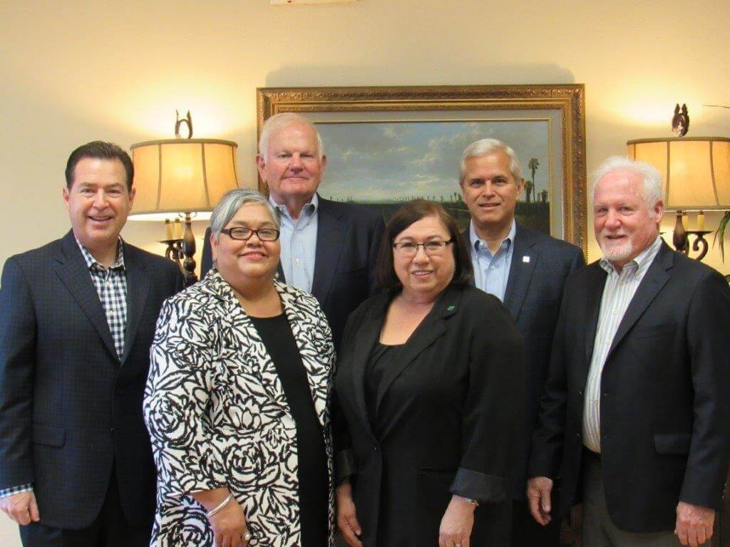 Group photo with two rows. Back row: Sam Foss Jones and David Salinas, President/CEO. Front row: Robert Lozano, Thelma Marroquin, Bertha Suarez, and Bud Payne.
